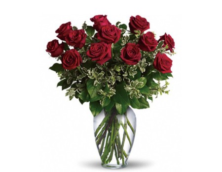 A dozen red roses in vase